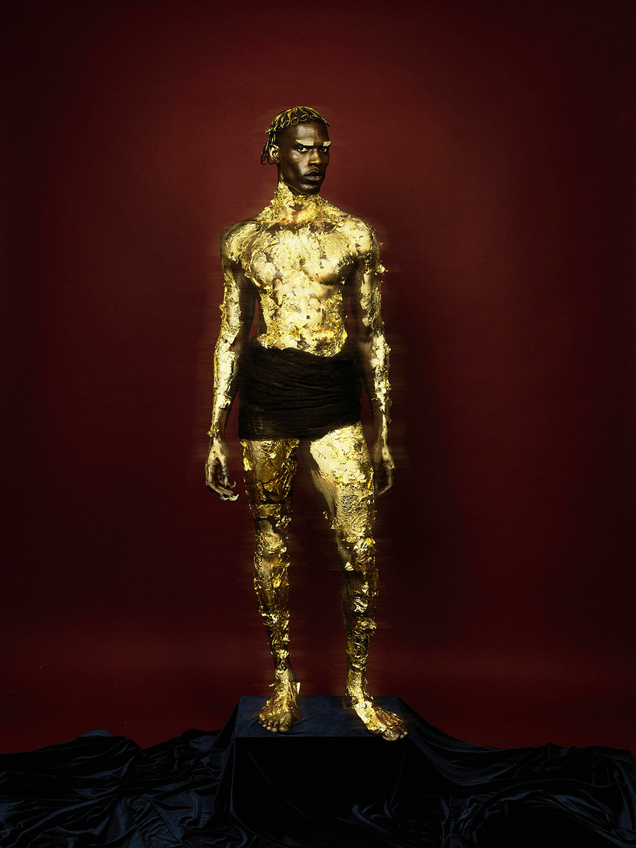 Gold-painted male model in New Religion for KALTBLUT